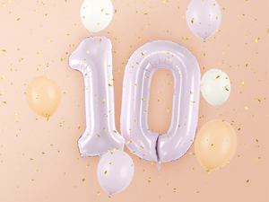 Purple number balloons combined to create 10